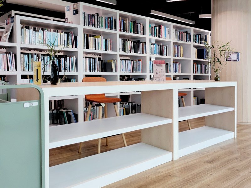 Library shelving system designed for durability and browsing access